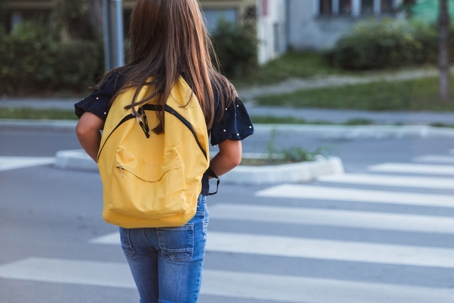 schoolchild crossing the street