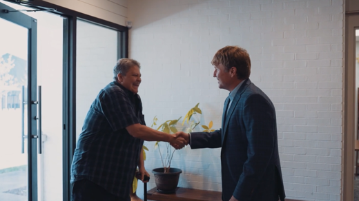 Client and Brian Carmichael shaking hands
