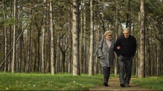 Image of older couple walking together